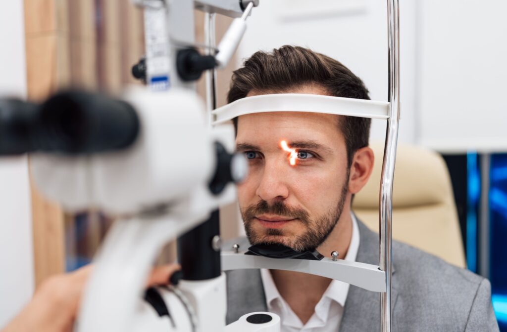 A person undergoing an annual eye exam covered by their health insurance.